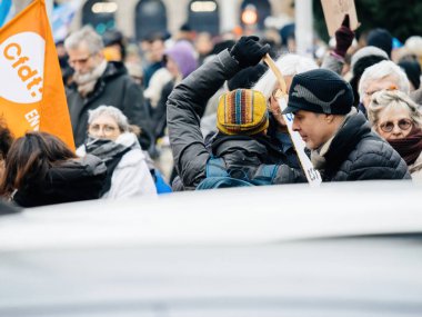 Strasbourg, France - 31 January 2023: Crowd marching at second demonstration against the new pension reform to be presented next month by French Prime Minister Elisabeth Borne