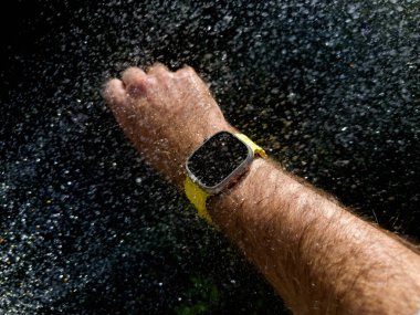 Paris, France - Sep 23, 2022: Unique perspective Underwater diving Male hand swimming with new titanium Apple Watch Ultra designed for extreme activities like endurance sports water drops on the oled