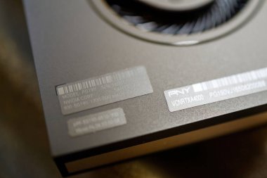 London, United Kingdom - Aug 5, 2022: Macro short with tilt-shift lens of New Nvidia Ampere PNY RTX A4000 gpu video card on model sticker and cooling fan