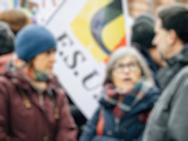 Strasbourg, France - 31 January 2023: Blur view of people at demonstration against the new pension reform to be presented next month by French Prime Minister Elisabeth Borne