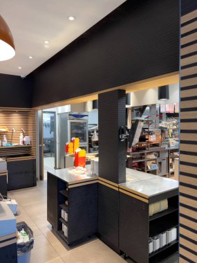 Paris, France - OCt 16, 2022: Interior of empty McDonalds fast food - vertical image