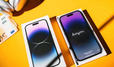 Paris, France - Sep 17, 2022: Bonjour text on the new Apple Computers iPhone 14 pro during initial setup