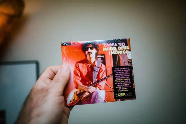 stock image Frankfurt, Germany - Mar 6, 2023: A male hand holding a newly purchased CD of Frank Zappas 1980 record, taken at the Mudd Club in Munich.