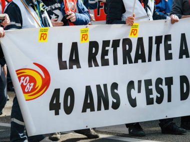 Strasborg, France - Mar 29, 2023: A crowd of protesters in Strasbourg, France holds placards with 40 Years signage to demonstrate against the recent rise in pension age. Weeks of protests and strikes clipart