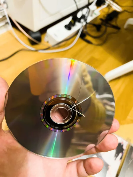 Man Looks Compact Disk Audio Damaged Transport — Stock Photo, Image