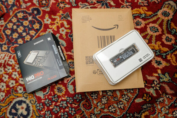Frankfurt, Germany - Jun 15, 2023: Living floor carpet with NVMe SSD unboxing reveals a Samsung 980 Pro computer disk drive. modern storage device. Perfect for highlighting the latest technology
