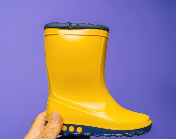 Pov Male Hand Presents Vibrant Yellow Childrens Boots White Violet — Stock Photo, Image