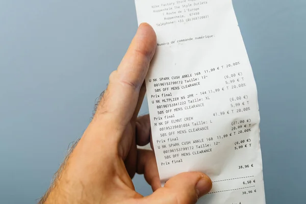 Paris France Oct 2023 Male Hand Holding Receipt Detailing Several — Stock Photo, Image