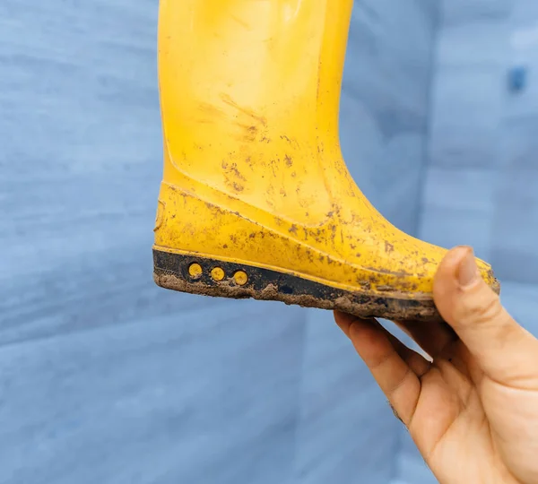 Male Hand Grips Pair Childs Yellow Rubber Boots Soiled Mud — Stock Photo, Image