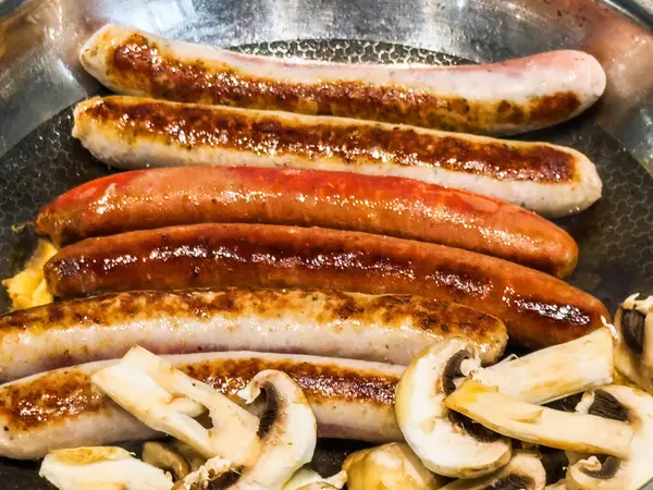 Close Macro Shot Sausages Champignon Mushrooms Sizzling Frying Pan — Stock Photo, Image
