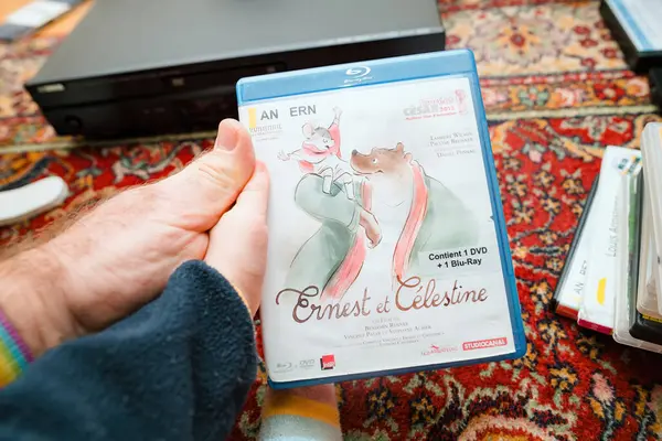 Paris France Dec 2023 Pov Father Showing New Dvd Ernest — стоковое фото