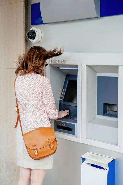 Woman Withdrawing Money Outdoor Atm Strong Gust Wind Sweeps Her — Stock Photo, Image