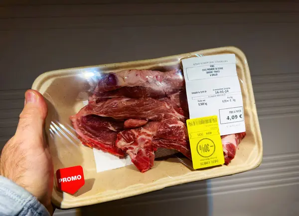 Paris France Jan 2024 Male Hand Holding Pork Meat Ready — Stock Photo, Image