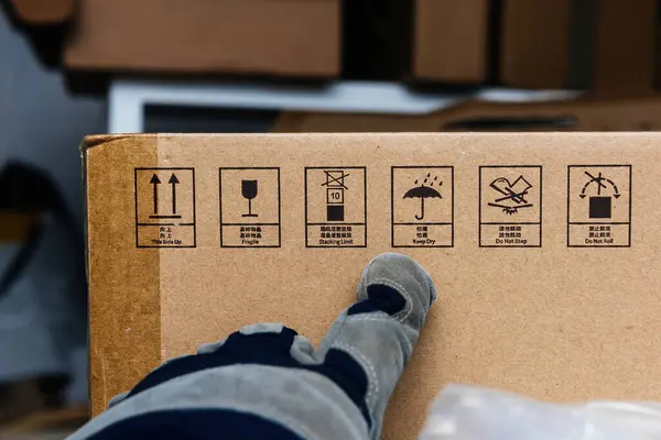 Warehouse Male Worker Wearing Gloves Points Cardboard Boxes Adorned Handling — Stock Photo, Image