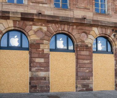 Strasbourg, France - Jul 7, 2023: An Apple Store in Strasbourg stands temporarily closed, its windows shielded with wooden panels after a protest led to property damage clipart