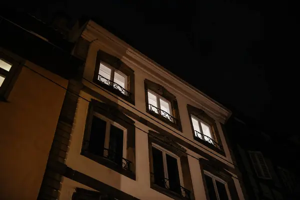 Windows Aglow Haussmann Style Building France Depicting Late Night Activity — Stock Photo, Image
