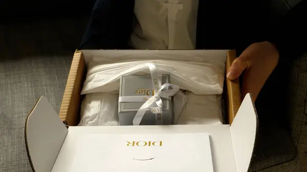 Paris France Sep 2023 Front View Woman Excitedly Unboxing Expensive Stock Image