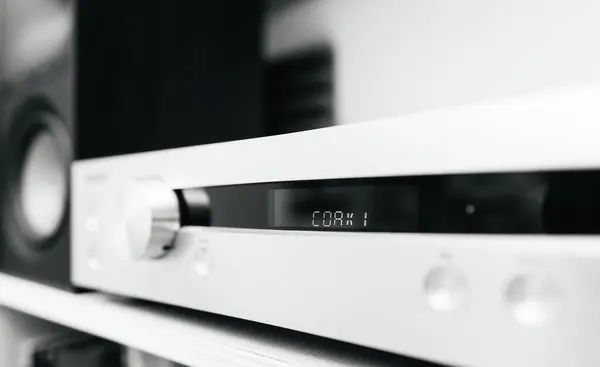stock image COAX 1 signage on the luxury preamplifier in an audiophile room, black and white image to illustrate an article about new music releases, emphasizing high-end audio equipment in a dedicated listening