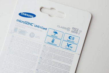 Frankfurt, Germany - Jan 14, 2015: Packaging for Samsung microSDHC UHS-I Card, featuring icons indicating it is waterproof, magnet proof, temperature proof, and X-ray proof. The package also mentions clipart
