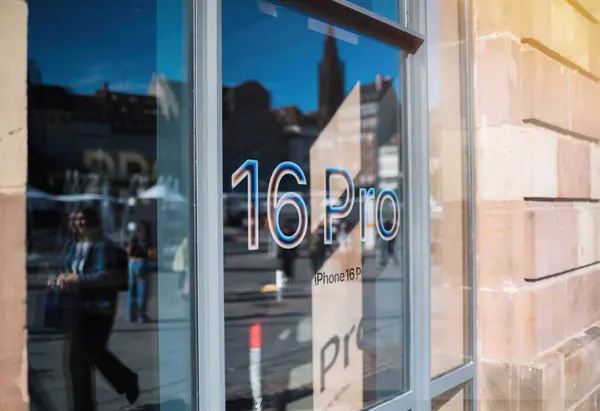 stock image Paris, France - Sep 20, 2024: A horizontal image of the Apple Stores glass entrance, featuring 16 Pro text on the main door, marking the launch of the new iPhone 16 Pro