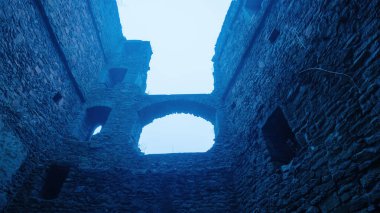 A haunting view of a castle's interior ruins under a blue-tinted light, with crumbling stone walls, arched windows, and a mysterious atmosphere. clipart