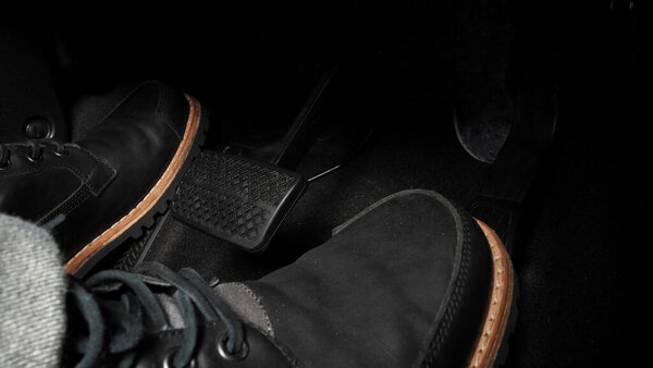 Car accelerate and brake foot pedal. Close up foot press or push foot break and accelerate pedal of a car to drive ahead. Driver driving the car by pressing or pushing accelerator pedals of the car.