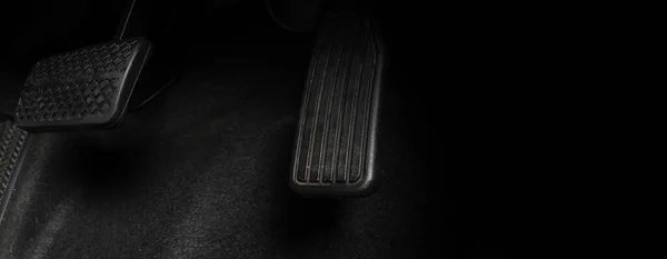Car accelerate and brake foot pedal. Close up foot press or push foot break and accelerate pedal of a car to drive ahead. Driver driving the car by pressing or pushing accelerator pedals of the car.