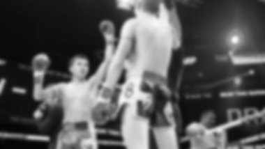 Blurred images black and white photo style of Thai boxing or Muay Thai or Kickboxing which local and foriegn boxer are fighting on the ring at indoor stage as martial art sport. Muay Thai Kick boxing