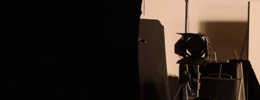 Film light for video production camera in studio set. Use as studio photo shoot light. Big LED spot light 5000w and diffuser or black panel create light like sun light can make daytime or golden hour