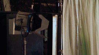 Film light for video production camera in studio set. Use as studio photo shoot light. Big LED spot light 5000w and diffuser or black panel create light like sun light can make daytime or golden hour