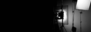 Film light for video production camera in studio set. Use as studio photo shoot light. Big LED spot light 5000w and diffuser or black panel create light like sun light can make daytime or golden hour