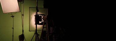 Film light for video production camera in studio set. Use as studio photo shoot light. Big LED spot light 5000w and diffuser or black panel create light like sun light can make daytime or golden hour