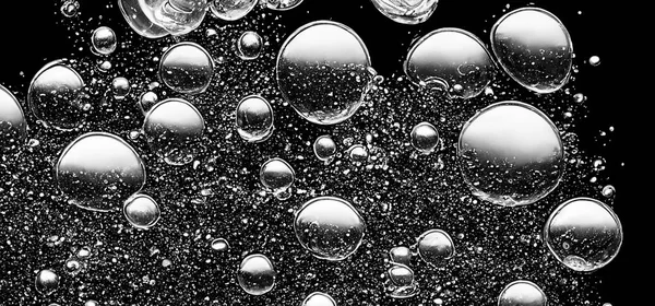 Burbujas Agua Soda Salpicando Bajo Agua Contra Fondo Negro Textura — Foto de Stock