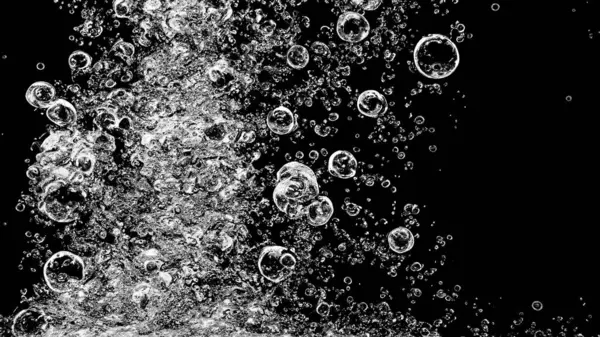 Soda water bubbles splashing underwater against black background. Soda liquid texture that fizzing and floating up to surface like a explosion in under water for refreshing carbonate drink concept.