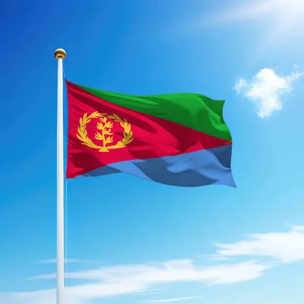 stock image Waving flag of Eritrea on flagpole with sky background. Template for independence day