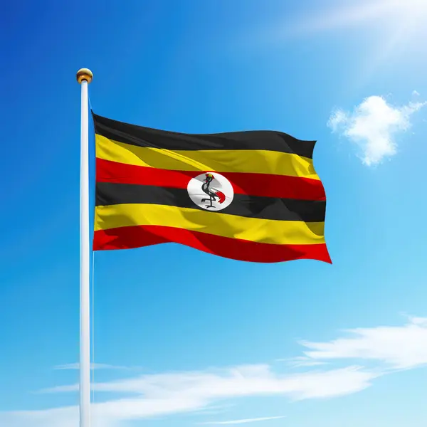 Acenando Bandeira Uganda Mastro Bandeira Com Fundo Céu Modelo Para — Fotografia de Stock