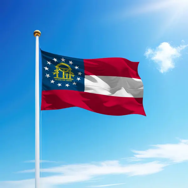 Waving flag of Georgia is a state of United States on flagpole with sky background.
