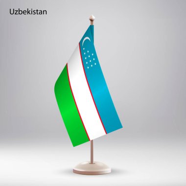 Bayrak standında asılı Özbekistan bayrağı. Zirve veya konferans sunumu için kullanılabilir
