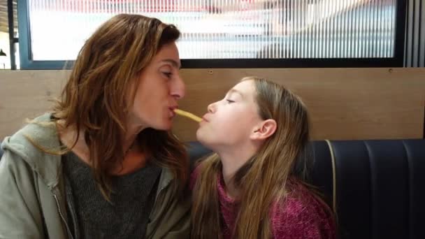 Mother Daughter Playing Together Eat French Fry Restaurant — Stock Video