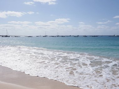 Shore of Atlantic Ocean in african Santa Maria town on Sal island in Cape Verde, clear blue sky in 2019 warm sunny spring day on April. clipart