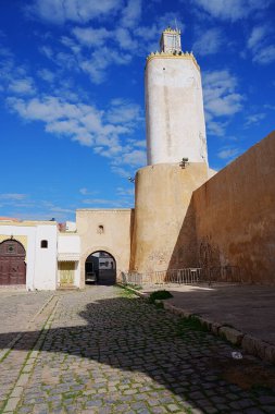 Old Portugese lighthouse in African MAZAGAN city in Morocco, clear blue sky in 2023 warm sunny winter day on January - vertical clipart