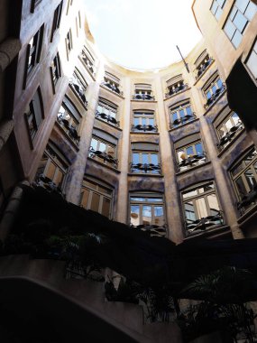 Patio in historical building in European BARCELONA city at Catalonia in SPAIN, clear blue sky in 2019 warm sunny summer day on September - vertical clipart