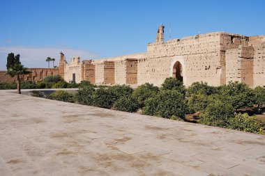 Walls of El Badi palace with stork's nests in African MARRAKESH city in MOROCCO, clear blue sky in 2023 warm sunny winter day on January. clipart