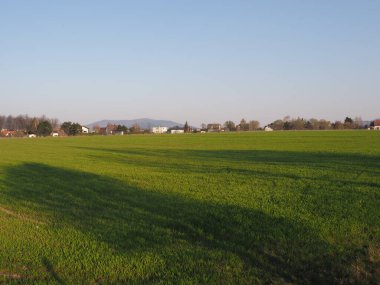 Grassy range seen from sport airfield in European Bielsko-Biala city in Poland, clear blue sky in 2020 warm sunny spring day on April. clipart