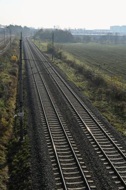 Electrified railway line near Brno, Czech Republic, in foggy morning