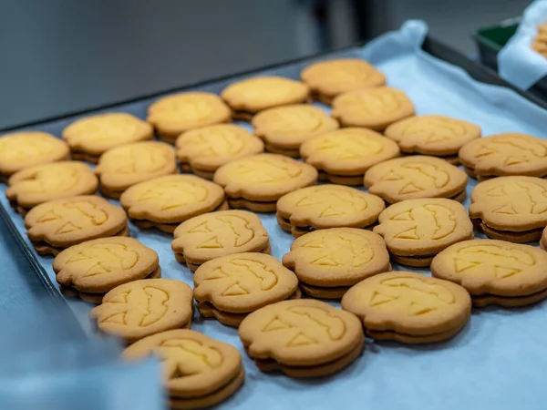 preparing sweet yellow cookies in the bakery