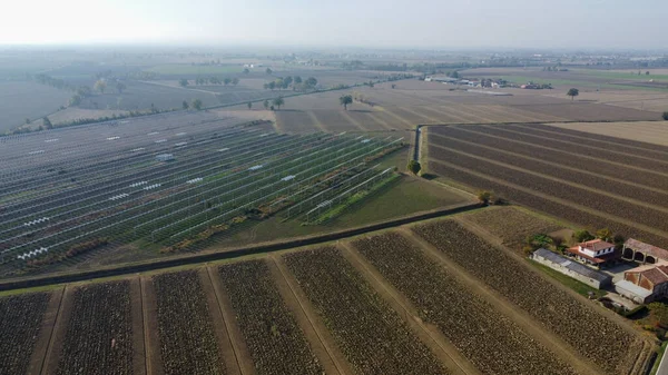 aerial view of rural ground farms and solar energy panels
