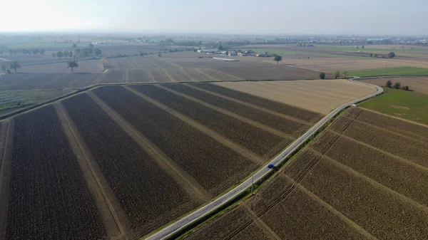 aerial view of rural ground farms and solar energy panels