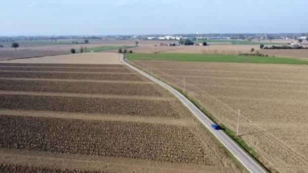 Aerial View Blue Car Traveling Rural Road Old Farms Solar — Stock Video