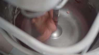 baker artisan making mixing kneading red coloured dough for holiday sweets and bread buns 4k video